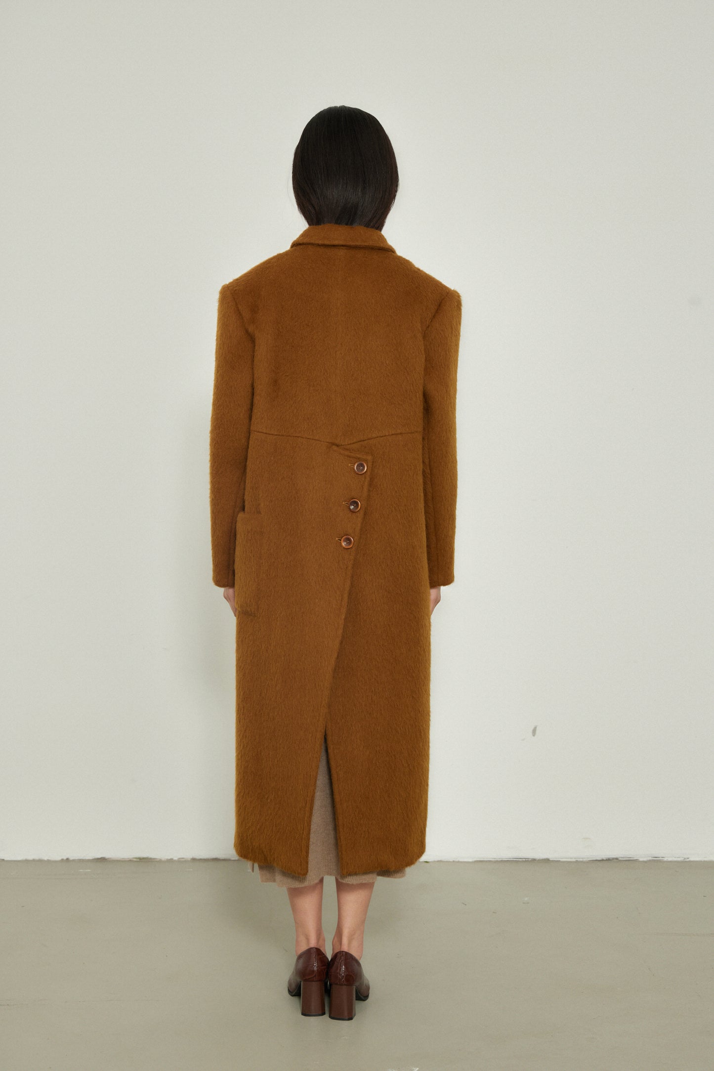 Manteau long design spécial au dos