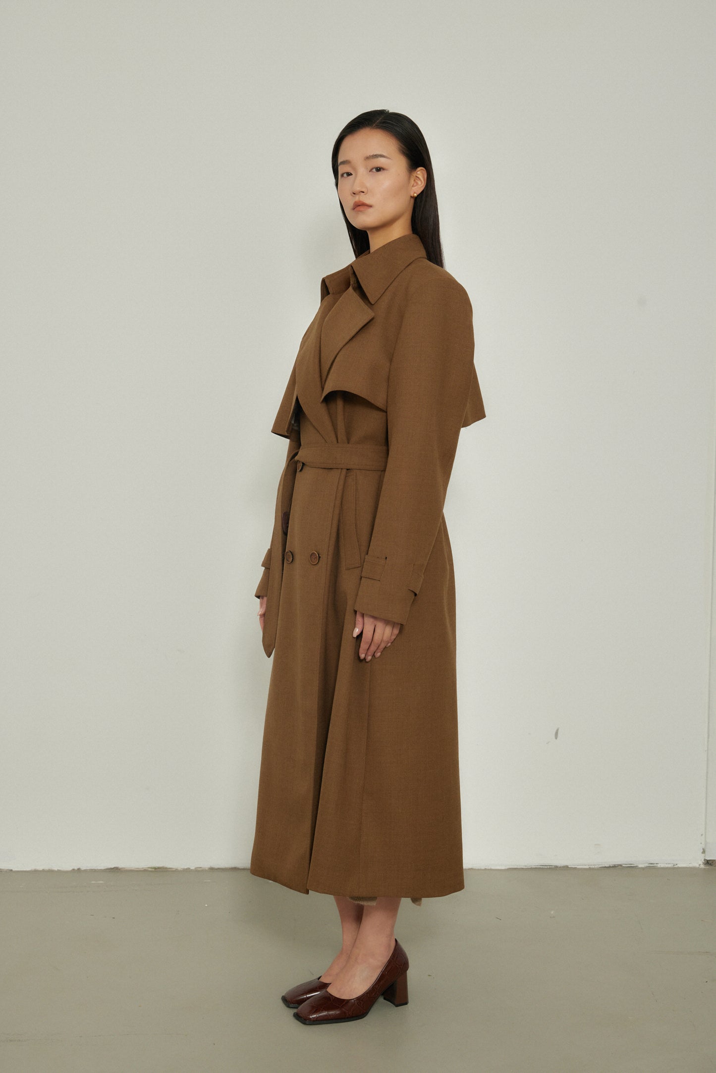 Manteau long design croisé au dos